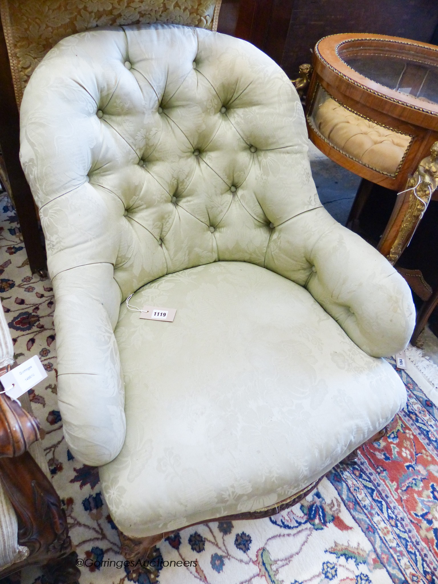 A Victorian walnut button back chair, on cabriole legs